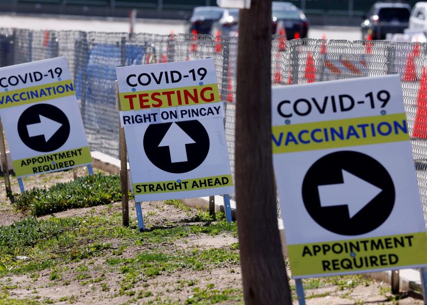 Signs guide the public at a large vaccination and testing site in Inglewood, California, on March 15, 2021. 
