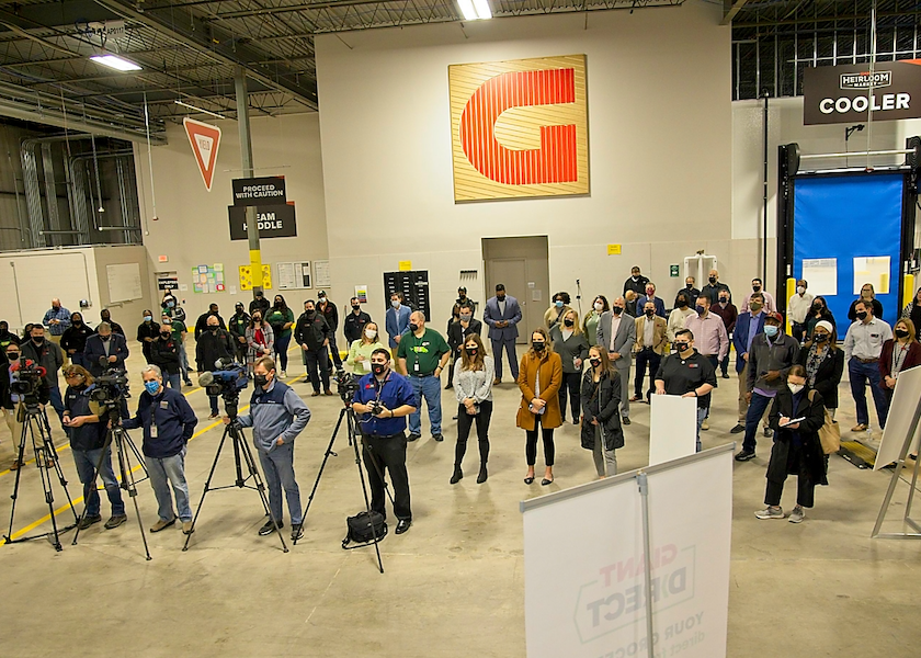 Several people attend the ribbon-cutting event for the new Giant Direct c-commerce fulfillment center in Philadelphia.