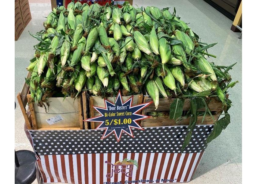 Sweet corn produce display from the Spring 2021 Produce Market Guide Produce Artist Award Series