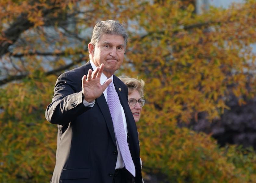 U.S. Senator Joe Manchin (D-WV) waves while walking outside the West Wing of the White House in Washington, U.S. November 18, 2021. 