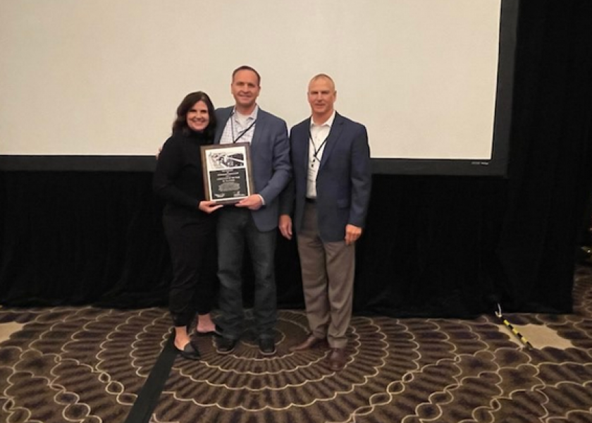Dr. Tye Perrett (center) was named consultant of the year by the Academy of Veterinary Consultants for 2021. With him is his wife, Tanya. The honor was presented to Dr. Perrett by Mitch Blanding (right), Zoetis associate director for beef technical services. Zoetis sponsors the annual award. 