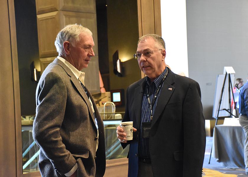 Don Laut (l) and Don Nikodim (r) catch up between sessions at the National Pork Industry Forum.