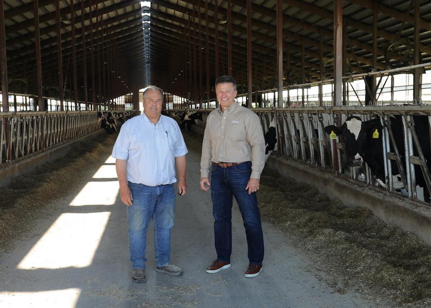Jim Winn, LASA board president and dairy farmer and project participant (left) and Greg Siegenthaler, Grande Cheese (right.)