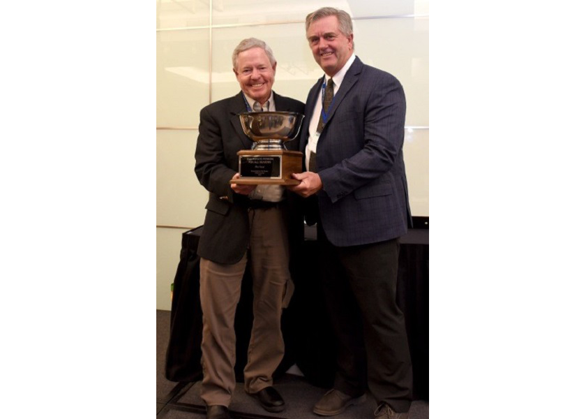 Pat Kole, (left) vice president at the Idaho Potato Commission was presented The Packer's 2022 Potato Person for All Seasons Award on Feb 28 at the National Potato Council's annual awards banquet by Tom Karst, editor emeritus of The Packer.