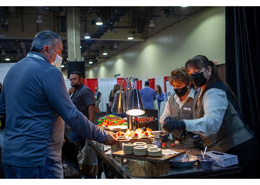 Masked-up attendees are shown at last year's Viva Fresh Expo. Organizers say, this year, they'll be taking the same types of COVID-19 safety precautions, including providing masks and beefing up sanitation efforts during the event.