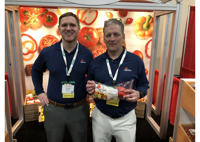 Anthony Otto, sales manager for Magic Sun Farms, and David Kyzer, regional sales manager, display greenhouse bell peppers grown in Central Mexico on April 23 at the Texas International Produce Association’s Viva Fresh Expo.