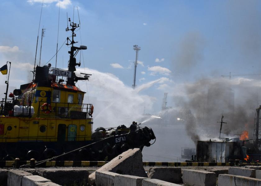 Firefighters work at a site of a Russian missile strike in a sea port of Odesa on July 23, 2022, as Russia's attack on Ukraine continues. (Press service of the Joint Forces of the South Defence Handout via REUTERS)
