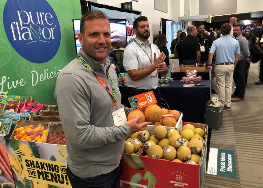Matt Mastronardi, executive vice president for Pure Hothouse Foods/Pure Flavor, displays the company's Solara Mini Melons at the IFPA Foodservice Conference Expo on July 29.