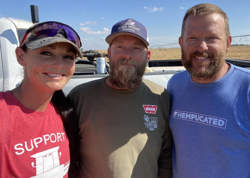 “Good times or bad times, any real farmer is always looking for genuine opportunity, and we knew the numbers were right,” says Aaron Baldwin, right, alongside his brother, Richard, center, and wife, Melissa. 