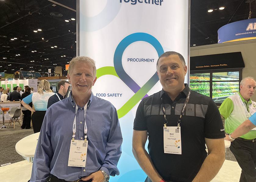 Procurant CEO Eric Peters and Matt Menner, head of 4PL sales–east at Uber Freight, greet clients at the Procurant booth.