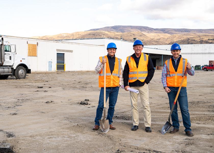 Stemilt leaders are shown ready to break ground at a new pear packing facility site. From left are Tate Mathison,  Jay Fulbright and West Mathison. 