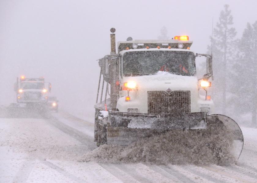 Snowplows clear Highway 88 in Woodford, California, as a winter storm hits the drought-stricken state. 