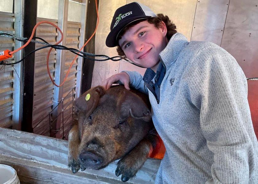 Myles Lee, 15, and his Duroc barrow after police found the missing pig following a 48-hour search.