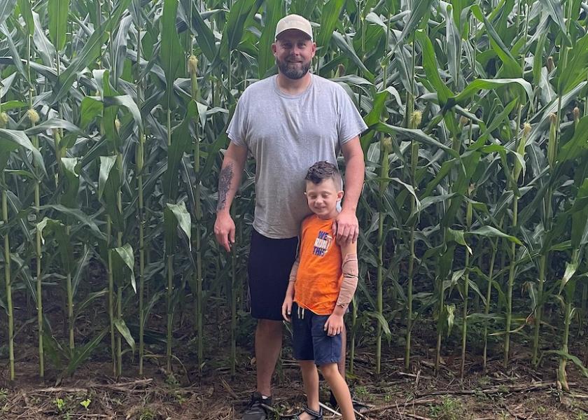 Russell Hedrick and his steady sidekick, Magnus, stand beside a bin-busting 40 that averaged a screaming 368 bpa—bookended by a contest spot that tallied a stunning 459.51 bpa. 