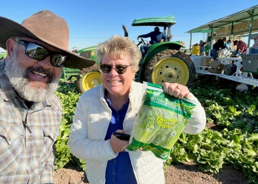 Ryan San Jose, sales manager, and Bonnie Poux, owner and founder of Klispell, Mont.-based Access Organics, check out some Organic Treat brand romaine hearts in a romaine lettuce field planted by Holtville, Calif.-based Mainas Farms LLC in California’s Imperial Valley. Poux says vegetable volume will fluctuate this season because of erratic weather patterns.