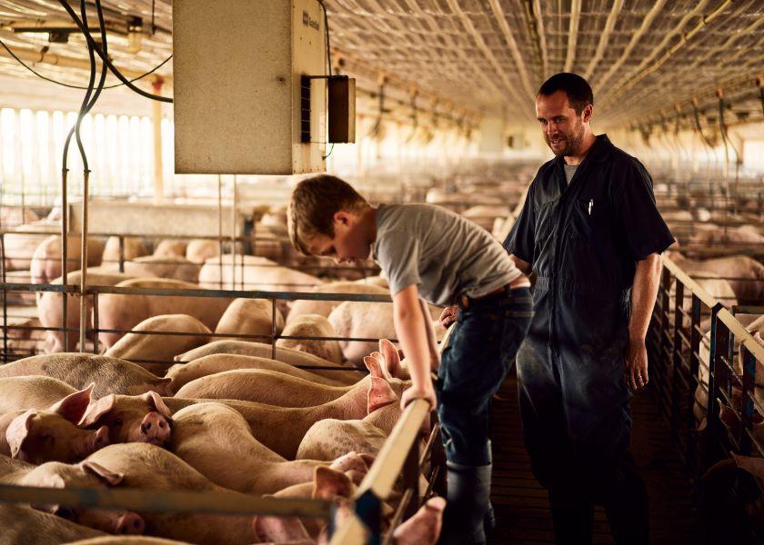 Chad Bell and his son Charlie on their farm near Viola, Ill.