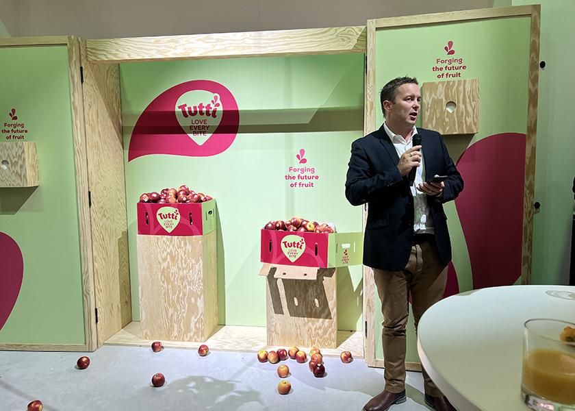 Morgan Rogers, VentureFruit’s general manager, reveals the Tutti apple at Fruit Logistica 2023.