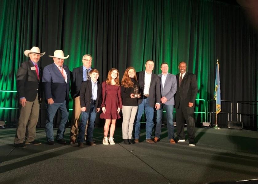Drs. Will and Monnie Carter, veterinarians based near Pintlala, Ala., and their children, were presented the Region ll award for their work to steward their land and water. The Carters own a cow herd consisting of Sim-Angus and Brangus crossbred females. 