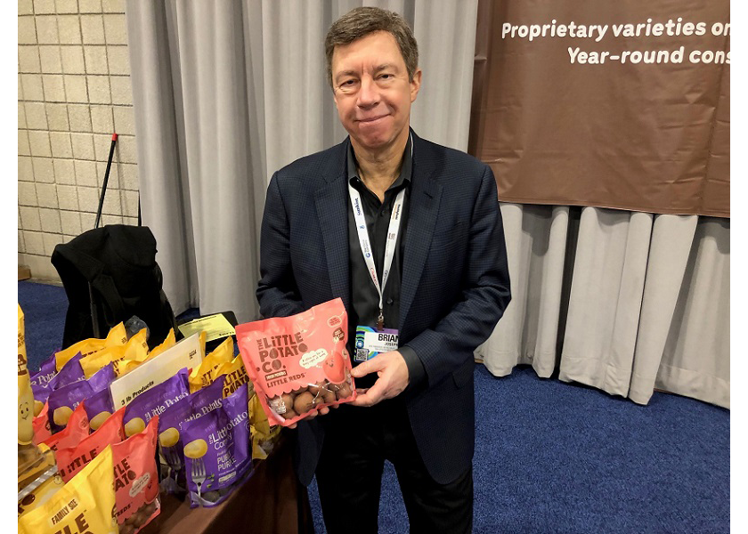 Brian Josephs, vice president of retail sales USA for the Little Potato Co., DeForest, Wis., displays the firm’s refreshed branding at the 2023 AWG Innovation Showcase in Overland Park, Kan.