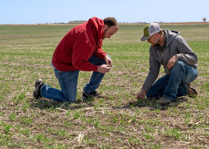 Environmental sustainability often leads to financial sustainability. Focusing on soil health, for example, can allow a farmer to cut back on certain purchased inputs or bank nutrients through practices such as no-till and cover crops. Nate Huntley (left) and Josh Nelson (right) farm in Wright County, Iowa. 