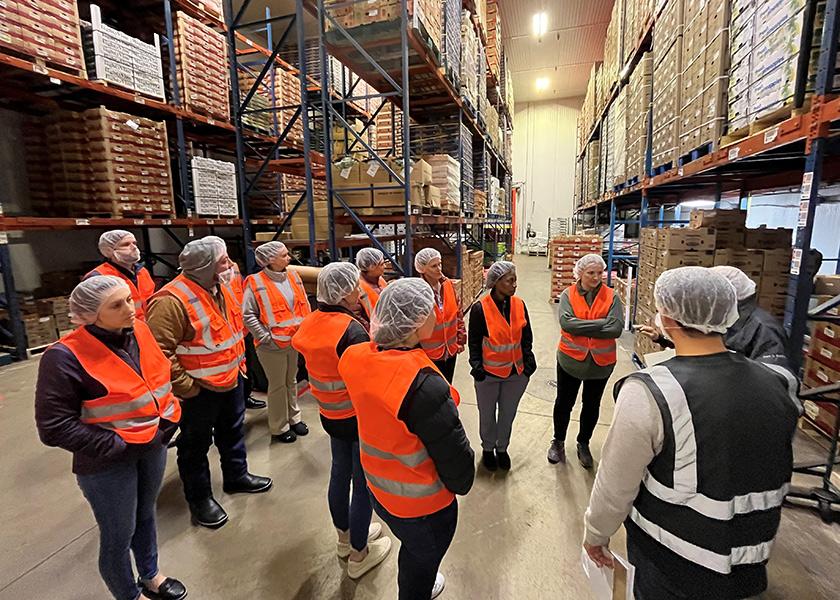 Participants in the International Fresh Produce Association’s Produce Safety Immersion Program tour a produce operation during a class trip to Chicago.