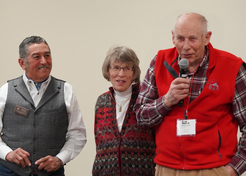 Past SRM President Dr. J. Alfonso “Poncho” Ortega listens as Chuck Jarecki and his wife, Penny, present their original concept for the award.