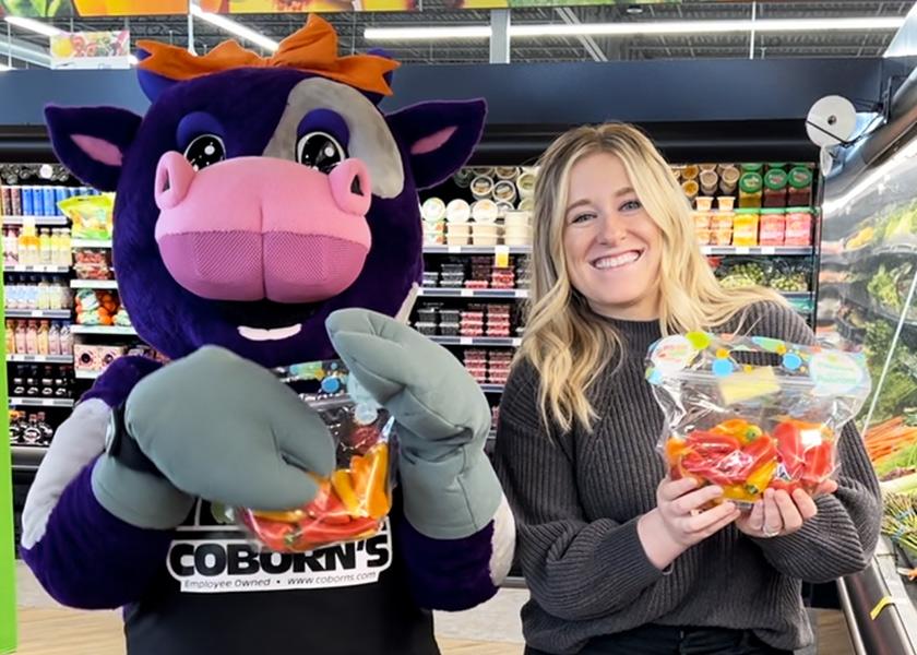 Coborn’s dietitian team designates certain produce-driven snacks as “Moo Items,” which are then promoted in stores and on Instagram by MooBell, the store mascot, shown here with Jessica Talbot, registered dietitian for Coborn’s. There’s also a designated page for Moo Items on the Coborn’s e-commerce site so parents can easily add them to their shopping carts. Photo: Courtesy of Coborn’s