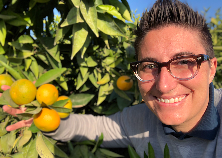 Fruit World founder and CEO Bianca Kaprielian checks out mandarins.