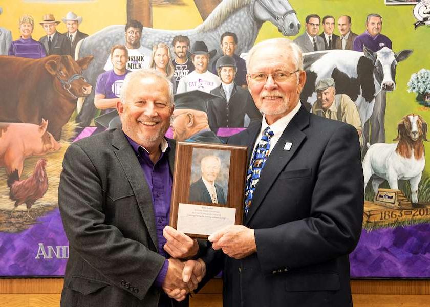 Kansas State department of animal science head Mike Day and distinguished alumnus Bob Smith, DVM.