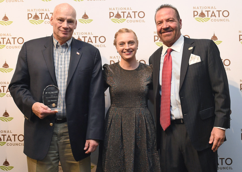 Christina Herrick, produce editor for The Packer, presented Jim Ehrlich, at left, with the 2024 Potato Person of the Year award at the National Potato Council’s 2024 Washington Summit. Outgoing NPC President RJ Andrus, right, thanked Ehrlich for his nearly two decades of service to the potato industry.