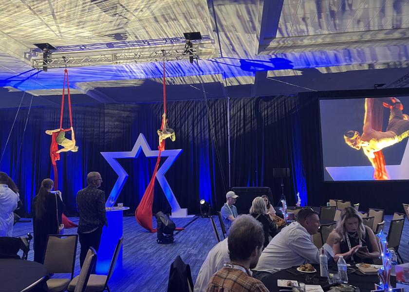 The opening gala of Southeast Produce Council's 2024 Southern Exposure featured food, drink and entertaining acts, including this pair of aerial acrobats.