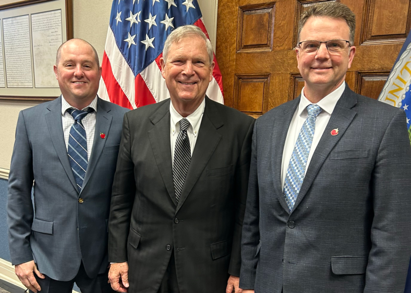 Brett Baker (left), vice chair of the U.S. Apple Association's board of directors (left), and Steve Clement (right), chair of USApple's board of directors, were among the association contingent that met with officials at the USDA, including Agriculture Secretary Tom Vilsack (center) in Washington, D.C.
