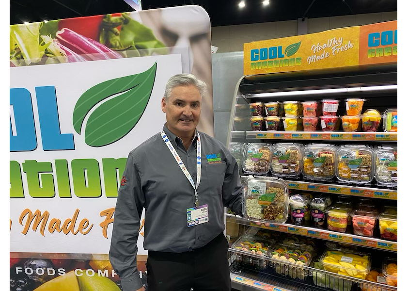 Greg Taylor, vice president of sales for Cool Creations, displays the company’s new grab-and-go fruit salad kit at the Associated Wholesale Grocers' seventh annual Innovation Showcase, held March 25-26.