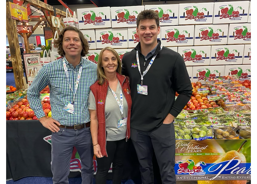 Shown from left are Kevin Steiner, president of business development and marketing for Sage Fruit Co.; Shari Hellums, sales representative; and Noah Croft, business development manager, at the Associated Wholesale Grocers' seventh annual Innovation Showcase on March 25.