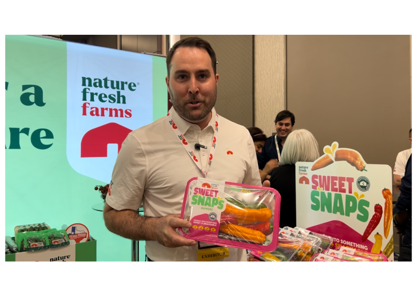 Spencer Lightfoot of Nature Fresh Farms showcases the newly introduced Sweet S’naps snacking peppers at the company’s booth at Viva Fresh Expo 2024.
