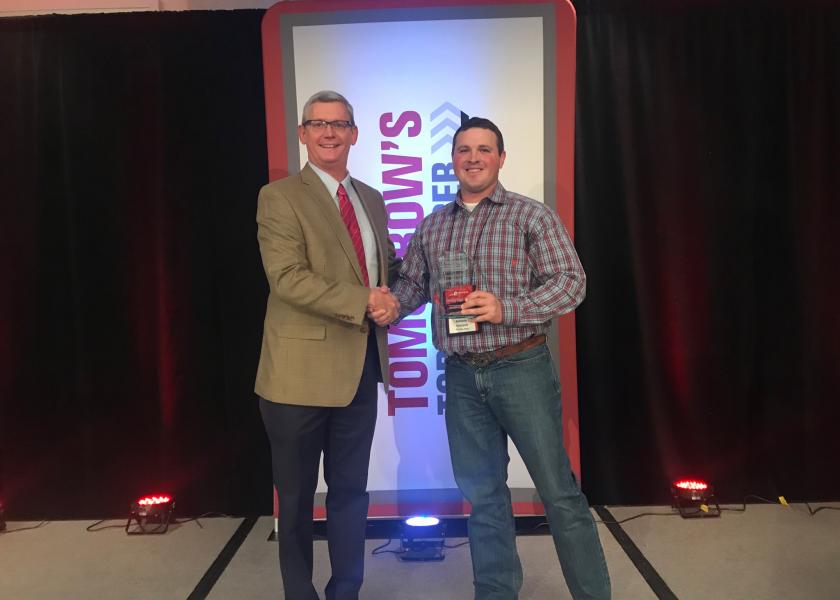 Mark Timke, national strategic account manager for Pioneer (left), congratulates Anthony Schwarck of Schwarck Farms in Riceville, Iowa, for being named the 2019 Tomorrow’s Top Producer Horizon Award winner at Farm Journal Media’s Top Producer Seminar in Chicago.