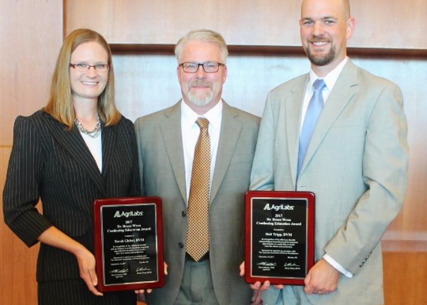 Last year’s recipients of the Dr. Bruce Wren award were Dr. Sarah Giebel (Dairy) and Dr. Holt Tripp (Beef). Pictured at center is Dr. Robert Rust, with sponsoring company AgriLabs. 