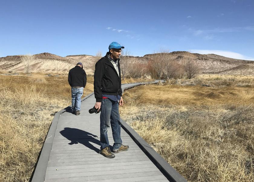 Len Warren, right, and John Zablocki from the The Nature Conservancy stand on the boardwalk at the Torrance Ranch Preserve north of Beatty, Nevada on Feb. 8, 2019. 