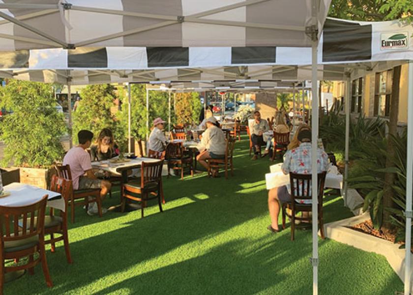 When indoor dining was banned once again in California restaurants due to a surge in coronavirus cases in July, foodservice operators were forced to get creative to keep their businesses afloat. At Milton’s deli in Del Mar, Calif., seven parking spaces in front of the restaurant were covered with artificial turf, and 20 shaded tables were set up, treating diners to al fresco dining. “We’re just trying to make the best of this moving target,” says owner Barry Robbins. “As far as customer experience, it’s been very positive,” he says. “People feel safer outside.”