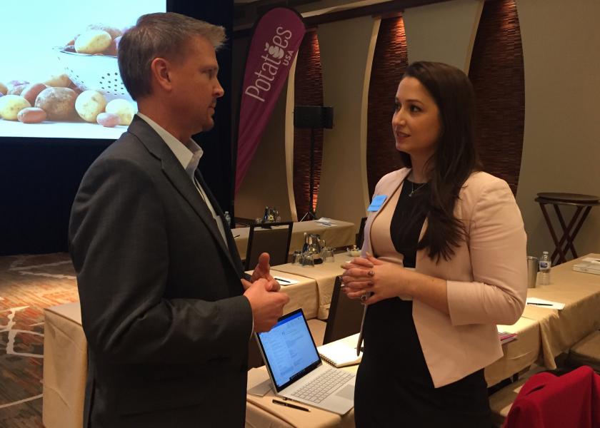 Mark Klompien, CEO of United Potato Growers of America, talks with Potatoes USA global marketing manager – school foodservice Rachael Lynch March 14 at the board’s annual meeting. 