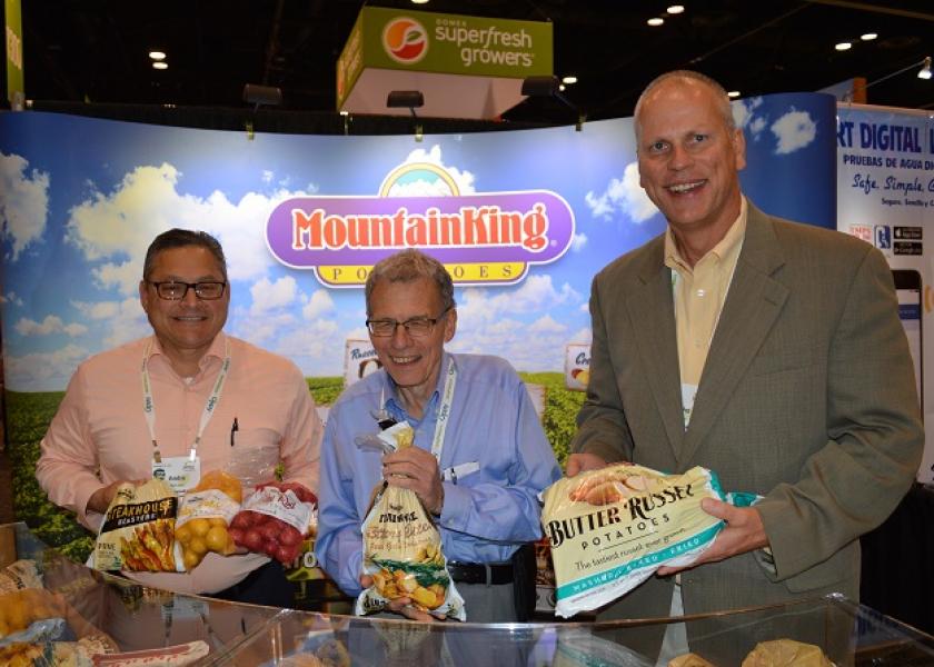  Andre Rohrman, sales representative for Mountain King Potatoes, with Cary Hoffman, president of Mountain King and John Pope, vice president of sales and marketing, with the Houston based company. 